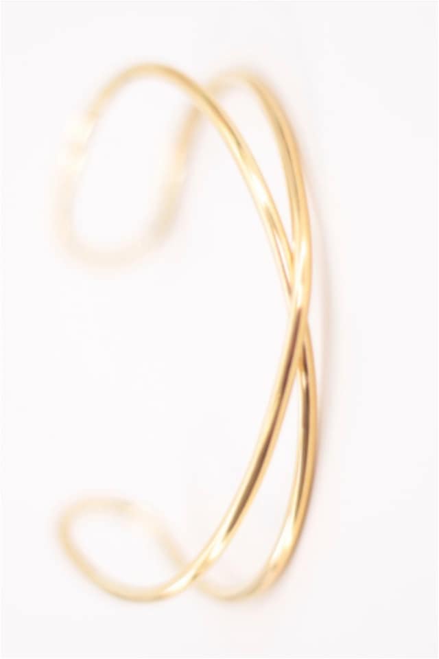 Brazalete mujer acero dorado cruzado